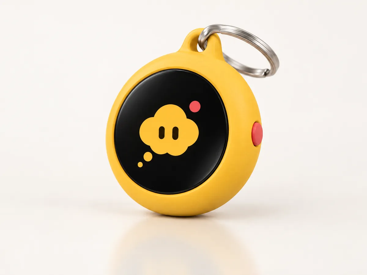 Concept image of a small round yellow keychain with a black screen showing the cloud mascot.